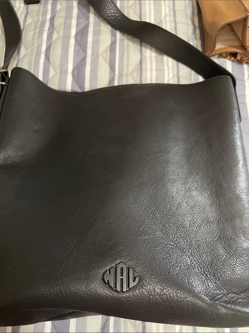 Classic Black Leather Shoulder Bag with Monogram Emblem